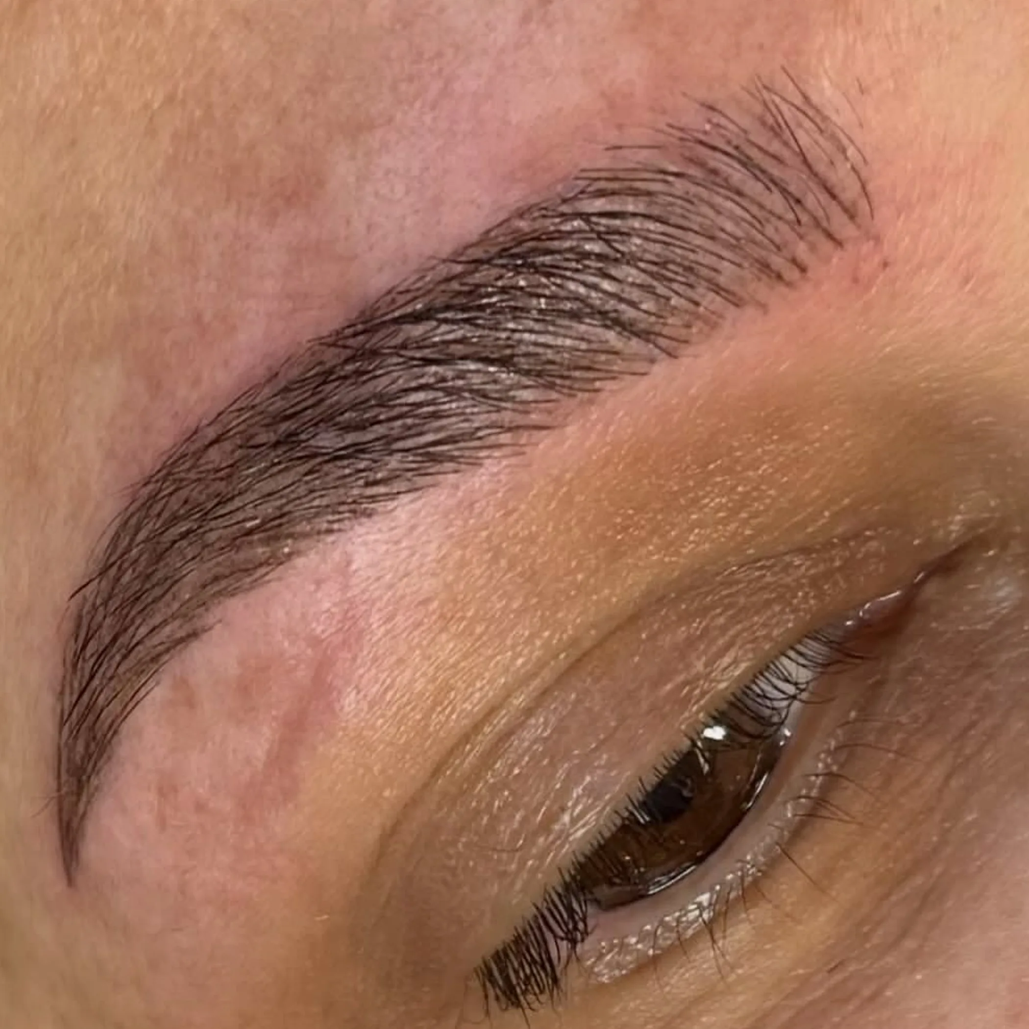 microblading on eyebrow close-up