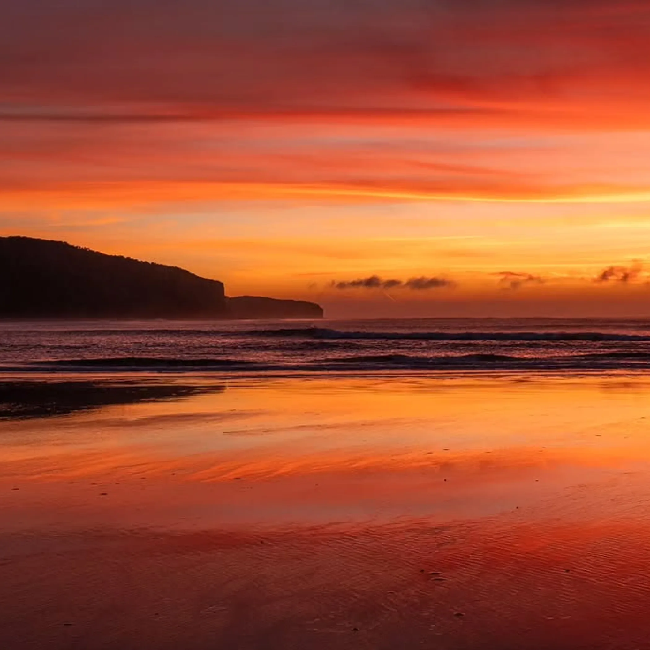 coastal sunrise over ocean cliffs